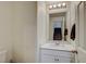 Bright bathroom with single sink vanity and white cabinets at 4240 Spring Storm Ave, North Las Vegas, NV 89081
