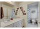 Bathroom with a dual sink vanity and shower and toilet area at 4240 Spring Storm Ave, North Las Vegas, NV 89081