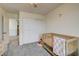 Bedroom with a crib and soft gray carpet at 4240 Spring Storm Ave, North Las Vegas, NV 89081