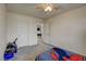 A bedroom with gray carpet, a ceiling fan, and a window at 4240 Spring Storm Ave, North Las Vegas, NV 89081