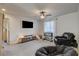 Bonus room featuring ceiling fan and a large window for natural light at 4240 Spring Storm Ave, North Las Vegas, NV 89081