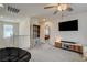 Bonus room offering ample seating, a ceiling fan, and tv at 4240 Spring Storm Ave, North Las Vegas, NV 89081
