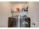 A well-equipped laundry room, featuring modern, side-by-side washer and dryer at 4240 Spring Storm Ave, North Las Vegas, NV 89081
