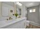 Lovely bathroom boasting double sinks, white vanity, and walk-in shower at 4637 Balfour Dr, Las Vegas, NV 89121
