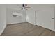 Bedroom with wood-look floors, ceiling fan, and closet at 4637 Balfour Dr, Las Vegas, NV 89121