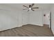 Bedroom with a ceiling fan, closet, and wood-look floors at 4637 Balfour Dr, Las Vegas, NV 89121