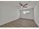 The bedroom features light vinyl floors, a ceiling fan, and a bright window at 4637 Balfour Dr, Las Vegas, NV 89121