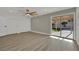 Bright bedroom with sliding glass doors to a patio and pool at 4637 Balfour Dr, Las Vegas, NV 89121