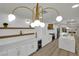 Updated kitchen featuring a large island, stainless steel appliances, and stylish pendant lighting at 4637 Balfour Dr, Las Vegas, NV 89121