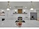 Well-lit kitchen features a large island, stainless steel appliances, and white cabinetry at 4637 Balfour Dr, Las Vegas, NV 89121