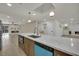 Open kitchen concept boasts a large island, stainless steel appliances, and modern finishes at 4637 Balfour Dr, Las Vegas, NV 89121