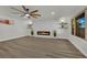 Elegant living room featuring a marble accent wall with fireplace, wood flooring and recessed lighting at 4637 Balfour Dr, Las Vegas, NV 89121