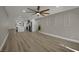 Living room with tile floors, fireplace, updated fan, and an open concept at 4637 Balfour Dr, Las Vegas, NV 89121