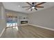 Bright living room features a fireplace, sliding doors, and access to the backyard pool at 4637 Balfour Dr, Las Vegas, NV 89121