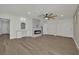 Open living area with fireplace, ceiling fan, and built-in cabinets at 4637 Balfour Dr, Las Vegas, NV 89121