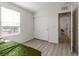 This bedroom has a closet and bright window, ideal for relaxing or working at 4976 Quiet Morning St, Las Vegas, NV 89122