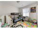 Playful bedroom with a bunk bed and colorful alphabet rug at 4976 Quiet Morning St, Las Vegas, NV 89122
