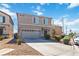 Two-story home features desert landscaping, a two-car garage, and a well-maintained front yard at 4976 Quiet Morning St, Las Vegas, NV 89122