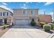 Two-story home features desert landscaping, a two-car garage, and a well-maintained front yard at 4976 Quiet Morning St, Las Vegas, NV 89122
