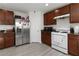 Efficient kitchen featuring stainless steel appliances and granite countertops at 4976 Quiet Morning St, Las Vegas, NV 89122