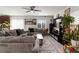 Inviting living room with a ceiling fan, neutral paint, and comfortable seating area at 4976 Quiet Morning St, Las Vegas, NV 89122
