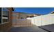 Fully fenced backyard features a concrete patio and low maintenance landscaping at 5045 Bayberry Crest St, North Las Vegas, NV 89031
