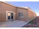 The backyard offers a concrete patio with access via sliding glass doors at 5045 Bayberry Crest St, North Las Vegas, NV 89031