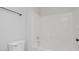 Minimalist bathroom design with a clean white tub and shower combination, and a sleek towel bar for modern convenience at 5045 Bayberry Crest St, North Las Vegas, NV 89031