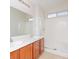 Bright bathroom with double sinks, a large mirror, and a combined shower and tub, maximizing space and light at 5045 Bayberry Crest St, North Las Vegas, NV 89031