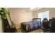 Bedroom with a ceiling fan, window, bed, desk, and modern décor at 5045 Bayberry Crest St, North Las Vegas, NV 89031