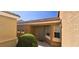 Inviting front entrance with a manicured shrub, covered porch and well-placed window enhances the curb appeal of the property at 5045 Bayberry Crest St, North Las Vegas, NV 89031