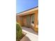 This home features a cozy front porch leading to the front door, framed by well-manicured landscaping and a bright window at 5045 Bayberry Crest St, North Las Vegas, NV 89031