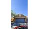 The home features a two-car garage and neutral stucco exterior for a clean and modern curb appeal at 5045 Bayberry Crest St, North Las Vegas, NV 89031