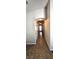 Hallway with tile flooring, arched ceilings, and recessed lighting, leading to various rooms in the home at 5045 Bayberry Crest St, North Las Vegas, NV 89031