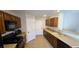 Functional kitchen layout with ample cabinet space, sleek appliances, and easy-to-clean tile floors, perfect for everyday cooking at 5045 Bayberry Crest St, North Las Vegas, NV 89031