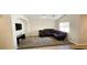 Open-concept living room with plush carpet, media center, and comfortable seating, great for relaxation at 5045 Bayberry Crest St, North Las Vegas, NV 89031