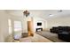 Open-concept living space with dining area, TV, and comfortable seating at 5045 Bayberry Crest St, North Las Vegas, NV 89031