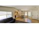 Bright and spacious living room with tile floors, dining area, and natural light, perfect for entertaining at 5045 Bayberry Crest St, North Las Vegas, NV 89031
