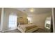 Comfortable main bedroom with vaulted ceilings, natural light, and a stylish mirrored accent wall at 5045 Bayberry Crest St, North Las Vegas, NV 89031