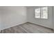 Bedroom with new gray flooring, and bright natural light coming through the window at 5155 W Tropicana Ave # 2095, Las Vegas, NV 89103