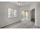 Bedroom featuring a ceiling fan, a window, and a sliding glass door to a balcony at 5155 W Tropicana Ave # 2095, Las Vegas, NV 89103