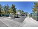 Gated entry to the community with well-maintained landscaping and mature trees at 5155 W Tropicana Ave # 2095, Las Vegas, NV 89103