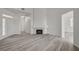 Open living area with fireplace and newly installed floors at 5155 W Tropicana Ave # 2095, Las Vegas, NV 89103