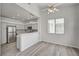 Living area showcasing modern lighting, gray cabinets, stainless steel appliances, and a breakfast bar at 5155 W Tropicana Ave # 2095, Las Vegas, NV 89103