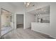 Living area featuring gray floors, sliding glass door, open access to the kitchen at 5155 W Tropicana Ave # 2095, Las Vegas, NV 89103