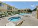 Community pool area with pools, lounge chairs, and building in the background at 5155 W Tropicana Ave # 2095, Las Vegas, NV 89103