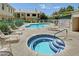 Community pool area featuring swimming pools, a jacuzzi, lounge chairs, and lush landscaping at 5155 W Tropicana Ave # 2095, Las Vegas, NV 89103