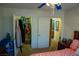 Bedroom with a closet, open to shelving, and access to an en-suite bathroom at 5216 Loma Verde Ave, Las Vegas, NV 89108