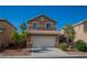 Charming two-story home with a two-car garage and well-maintained landscaping in a quiet neighborhood at 5216 Loma Verde Ave, Las Vegas, NV 89108