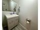 Bathroom featuring a modern vanity, large mirror, and stylish fixtures at 5474 S Maryland Pkwy, Las Vegas, NV 89119